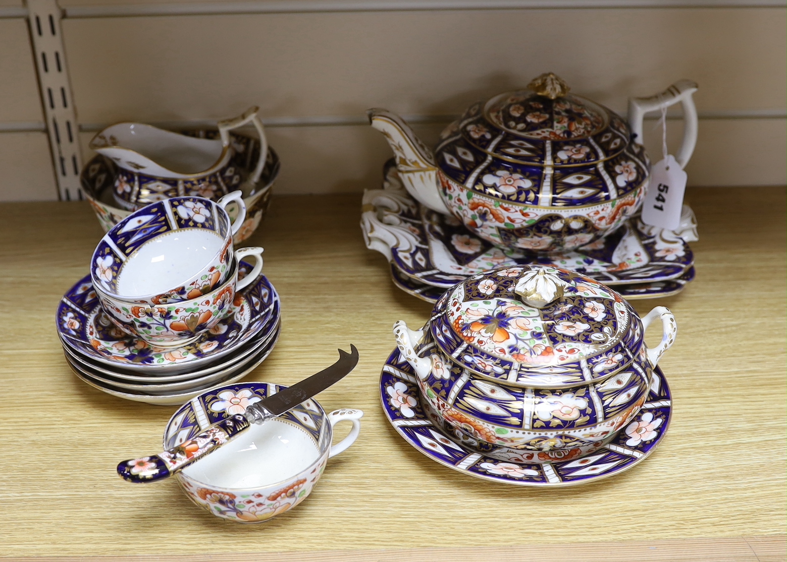 A mid 19th century Derby Imari pattern tea service, comprising a pair of two handled cake plates, a teapot on stand, a sucrier, a cream jug, a bowl and cover, three cups and four saucers, NB: From the Estate of Rt Hon Lo